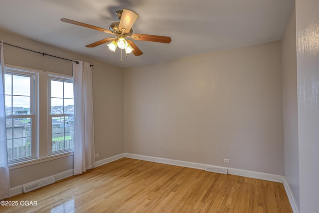 2502 S Tyler Ave, Joplin, MO 64804 - empty room featuring light wood-style flooring, baseboards, and a ceiling fan