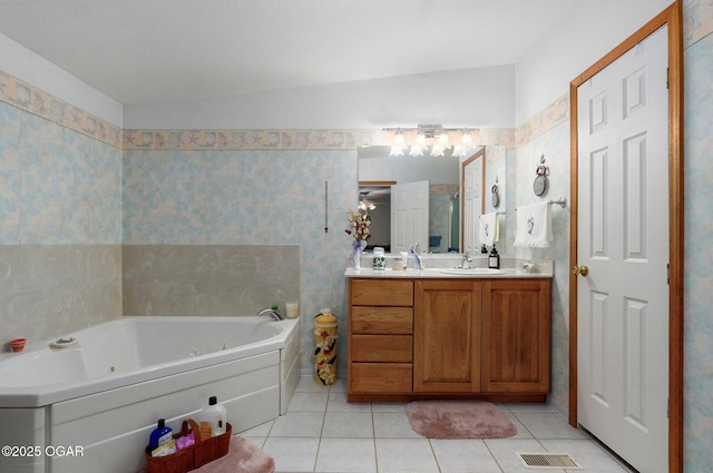 3759 Wheeler Branch Rd, Crane, MO 65633 - bathroom featuring vanity, a jetted tub, and tile patterned flooring