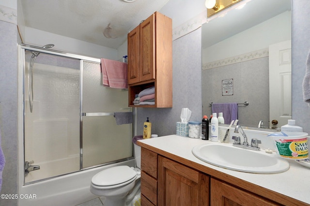 3759 Wheeler Branch Rd, Crane, MO 65633 - bathroom with vanity, bath / shower combo with glass door, and toilet