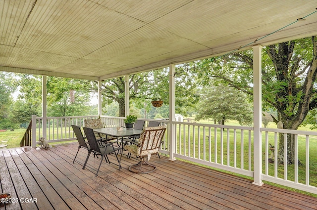 3759 Wheeler Branch Rd, Crane, MO 65633 - deck featuring outdoor dining area, a lawn, and view of scattered trees