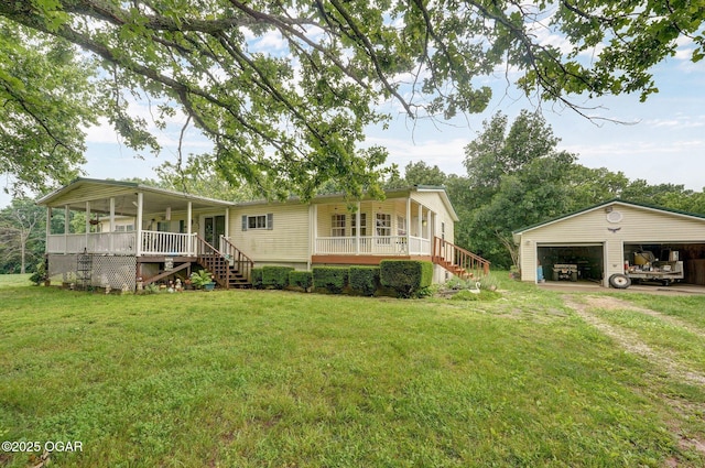 3759 Wheeler Branch Rd, Crane, MO 65633 - view of front of house with covered porch, stairs, a garage, and a front yard