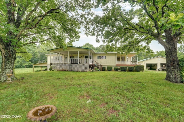 3759 Wheeler Branch Rd, Crane, MO 65633 - rear view of house featuring a yard, a garage, a porch, and stairs
