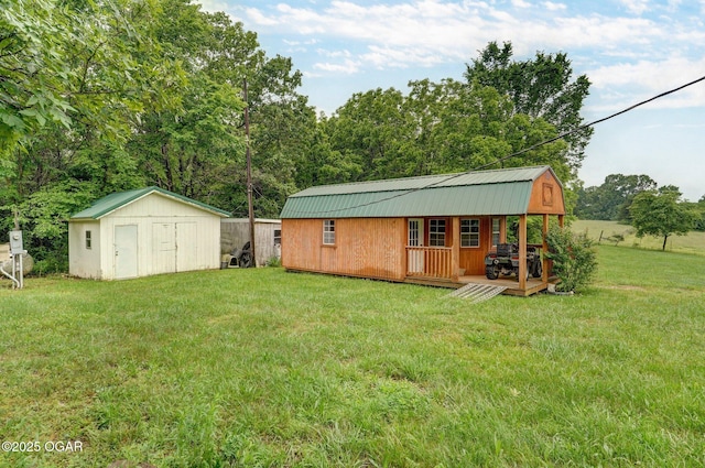 3759 Wheeler Branch Rd, Crane, MO 65633 - back of house with metal roof, a lawn, and a gambrel roof