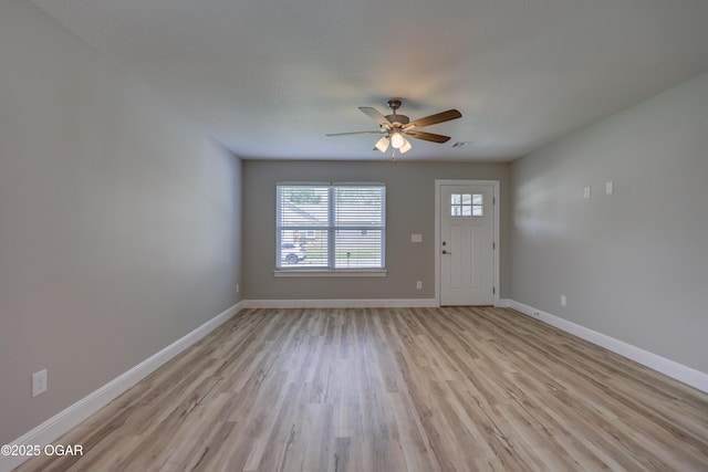 foyer entrance featuring ceiling fan and light wood-type flooring