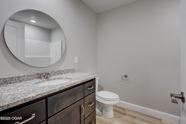 bathroom with vanity and wood finished floors