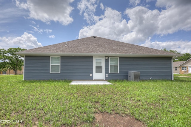 rear view of house featuring a patio and a lawn