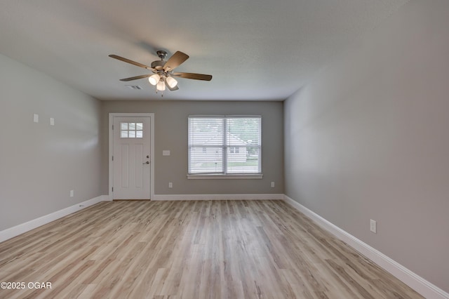 entrance foyer with light wood-type flooring and a ceiling fan