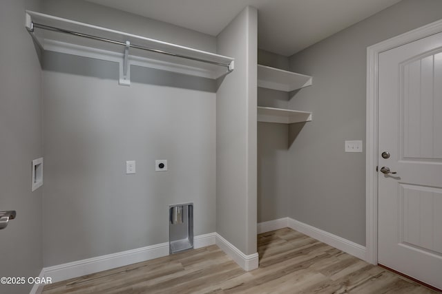 laundry room featuring electric dryer hookup, light wood-style floors, and washer hookup