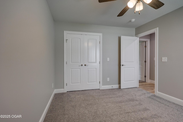 unfurnished bedroom featuring light colored carpet, a closet, and ceiling fan