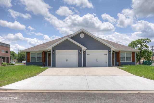 ranch-style house featuring an attached garage, a front lawn, and driveway