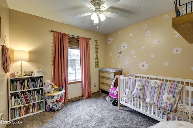 2413 Rolla St, Joplin, MO 64801 - bedroom featuring carpet floors, a ceiling fan, a crib, and baseboards