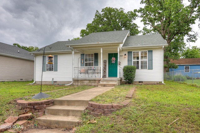 2413 Rolla St, Joplin, MO 64801 - view of front facade with crawl space, covered porch, and roof with shingles