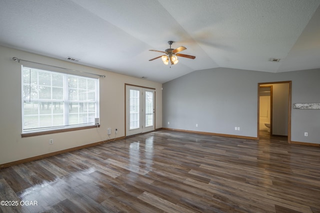 522 E Yale St, Liberal, MO 64762 - unfurnished room featuring ceiling fan, lofted ceiling, wood finished floors, baseboards, and a textured ceiling
