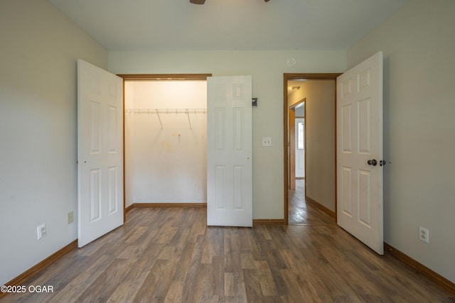 522 E Yale St, Liberal, MO 64762 - unfurnished bedroom with wood finished floors and baseboards