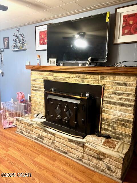 1300 S Baker Blvd, Carthage, MO 64836 - detailed view of a brick fireplace and wood finished floors
