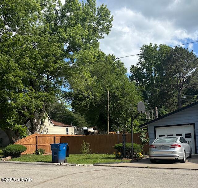 1300 S Baker Blvd, Carthage, MO 64836 - view of home's exterior with a detached garage