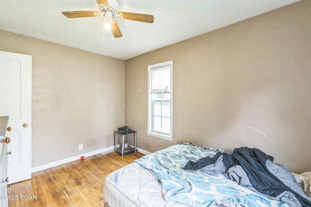 1426 Greenwood Blvd, Neosho, MO 64850 - bedroom with light wood-style floors, baseboards, and a ceiling fan