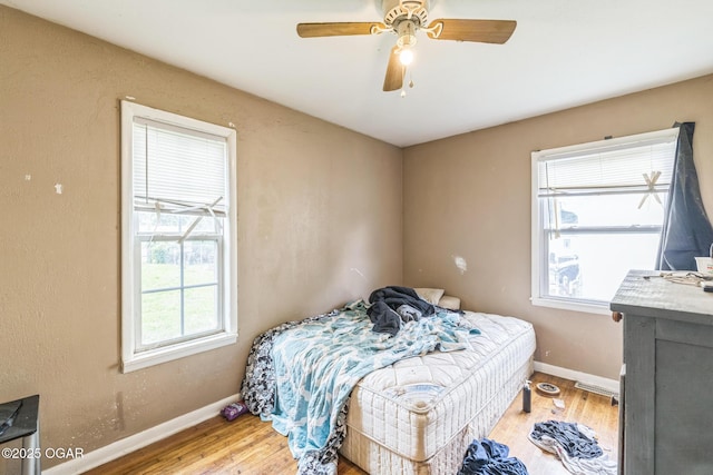 1426 Greenwood Blvd, Neosho, MO 64850 - bedroom featuring wood finished floors, baseboards, and a ceiling fan