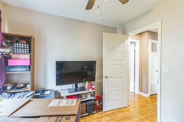 1426 Greenwood Blvd, Neosho, MO 64850 - office space with a ceiling fan, wood finished floors, and baseboards