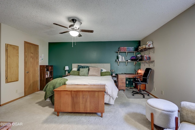 1241 Douglas Ct, Carthage, MO 64836 - bedroom with light carpet, a desk, a textured ceiling, a ceiling fan, and baseboards