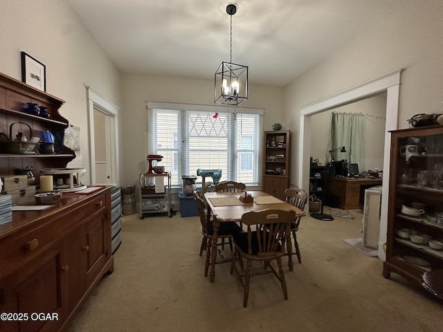 2022 S Jackson Ave, Joplin, MO 64804 - dining room with light carpet and a chandelier