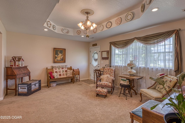 4430 E 26th St, Joplin, MO 64804 - living area featuring a textured ceiling, carpet flooring, a chandelier, baseboards, and recessed lighting