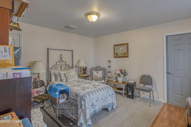 4430 E 26th St, Joplin, MO 64804 - bedroom featuring wood finished floors and a textured ceiling