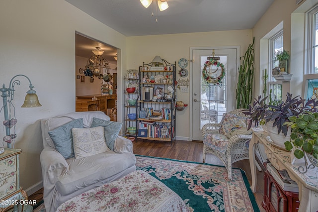 4430 E 26th St, Joplin, MO 64804 - sitting room featuring wood finished floors, baseboards, and ceiling fan