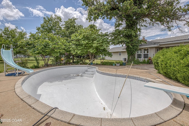 4430 E 26th St, Joplin, MO 64804 - view of swimming pool with a water slide, a diving board, and an empty pool