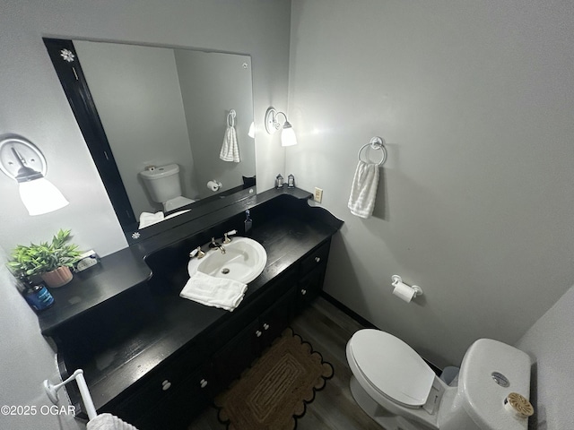 1910 Carolina Ave, Joplin, MO 64801 - half bath with toilet, wood finished floors, and vanity
