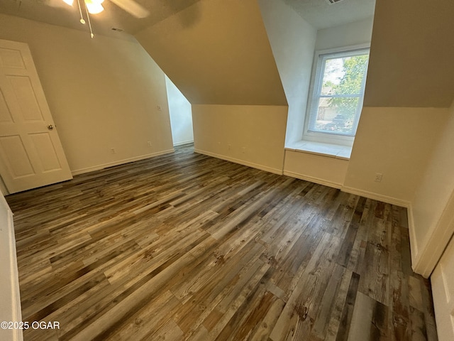 1910 Carolina Ave, Joplin, MO 64801 - additional living space featuring dark wood-style floors, lofted ceiling, baseboards, and ceiling fan