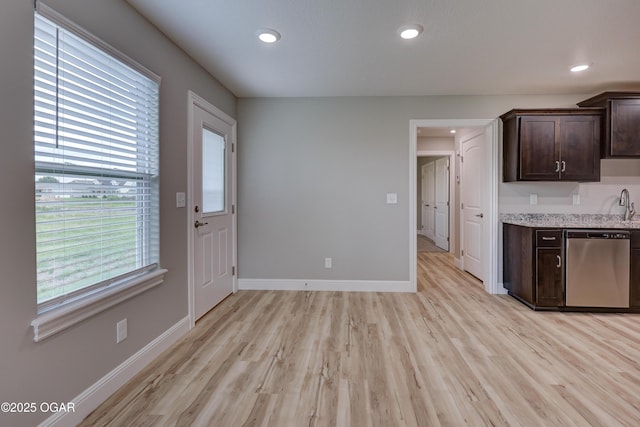1919 Wisconsin Ave, Joplin, MO 64804 - kitchen with stainless steel dishwasher, dark brown cabinets, light wood-style floors, and recessed lighting