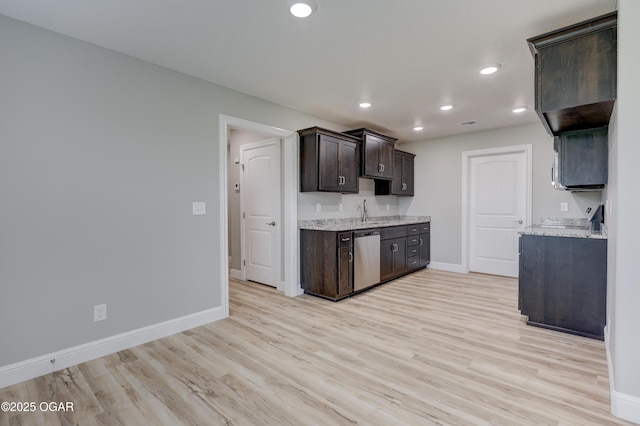 1919 Wisconsin Ave, Joplin, MO 64804 - kitchen with dishwasher, dark brown cabinetry, light wood-style floors, recessed lighting, and light stone counters