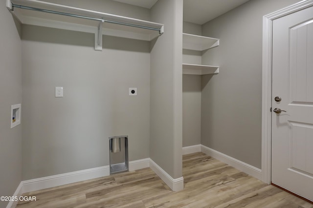 1919 Wisconsin Ave, Joplin, MO 64804 - washroom featuring light wood-type flooring, hookup for an electric dryer, and washer hookup