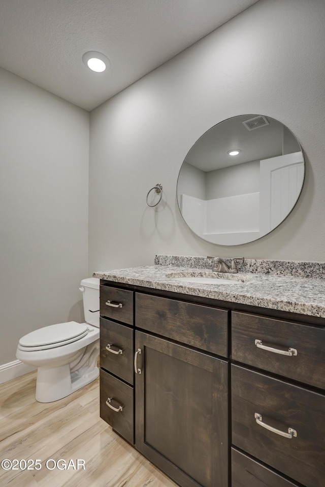 1919 Wisconsin Ave, Joplin, MO 64804 - bathroom with vanity and wood finished floors