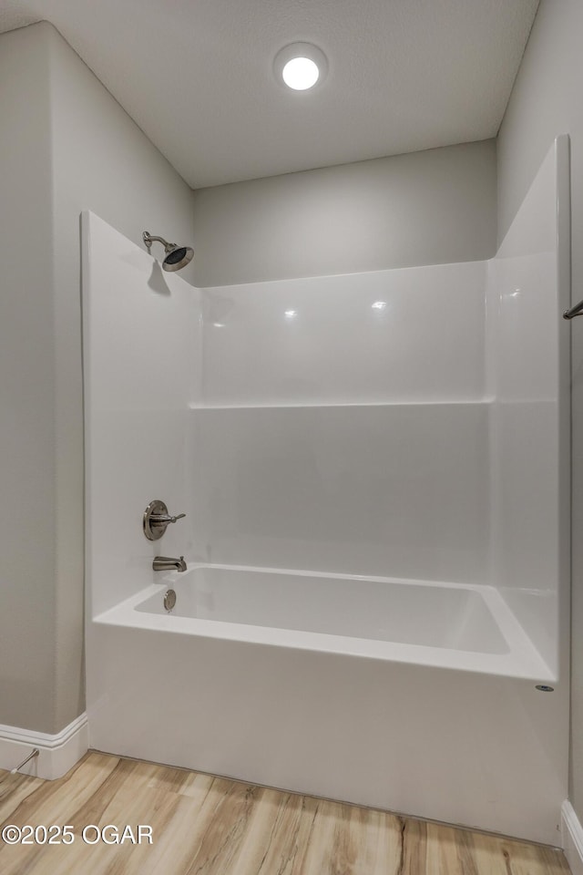 1919 Wisconsin Ave, Joplin, MO 64804 - bathroom featuring wood finished floors and shower / washtub combination