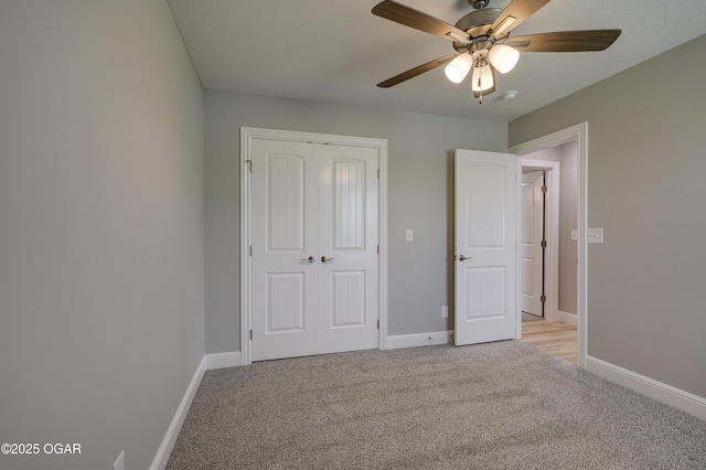 1919 Wisconsin Ave, Joplin, MO 64804 - unfurnished bedroom featuring light carpet, a closet, and a ceiling fan