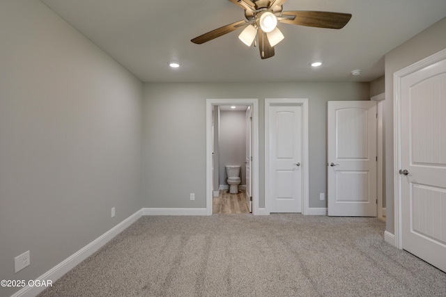 1919 Wisconsin Ave, Joplin, MO 64804 - unfurnished bedroom featuring carpet floors, recessed lighting, ensuite bath, and a ceiling fan