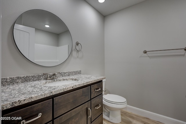 1919 Wisconsin Ave, Joplin, MO 64804 - bathroom with vanity and wood finished floors