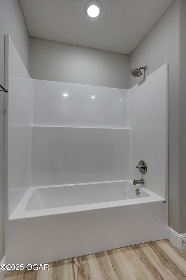 1919 Wisconsin Ave, Joplin, MO 64804 - bathroom with wood finished floors and shower / bathtub combination