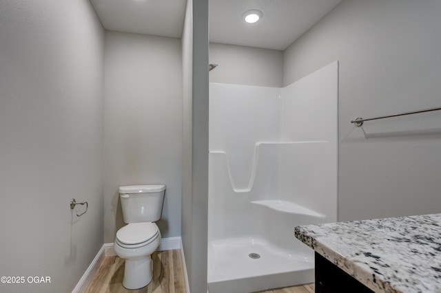 1919 Wisconsin Ave, Joplin, MO 64804 - full bath featuring a shower, vanity, and wood finished floors