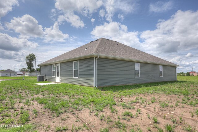 1919 Wisconsin Ave, Joplin, MO 64804 - view of side of property with a central AC unit and roof with shingles