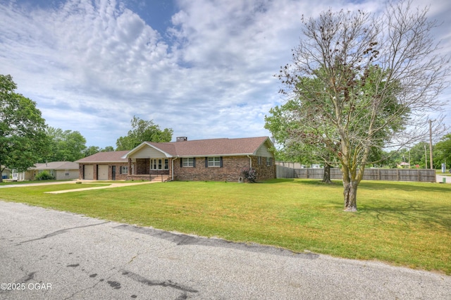 720 Sheridan Ave, Carl Junction, MO 64834 - single story home with brick siding, an attached garage, a chimney, and driveway