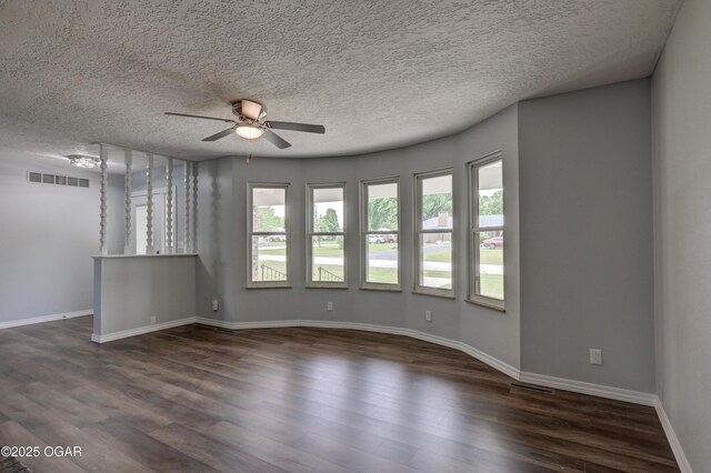 720 Sheridan Ave, Carl Junction, MO 64834 - empty room with ceiling fan, dark wood-style floors, baseboards, and a textured ceiling