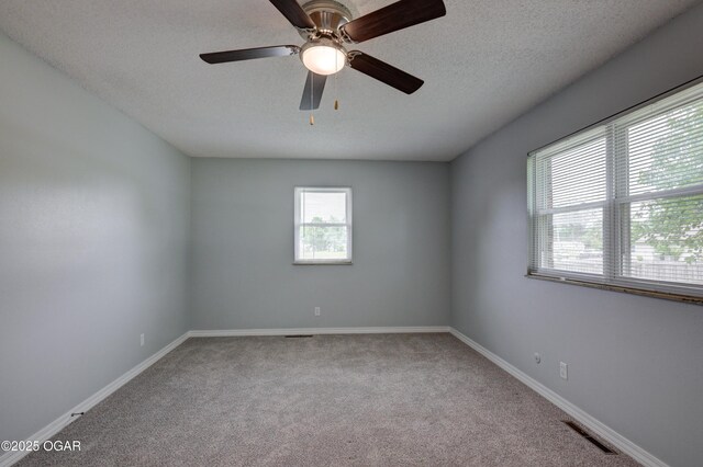 720 Sheridan Ave, Carl Junction, MO 64834 - carpeted empty room featuring a ceiling fan, baseboards, and a textured ceiling