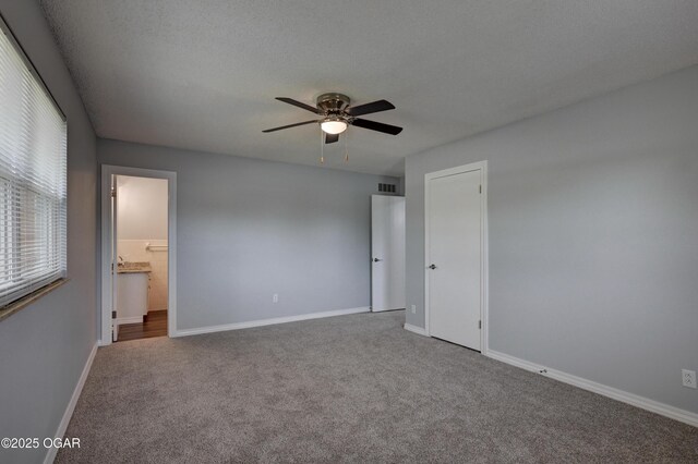 720 Sheridan Ave, Carl Junction, MO 64834 - unfurnished bedroom with carpet, baseboards, ensuite bathroom, and a ceiling fan
