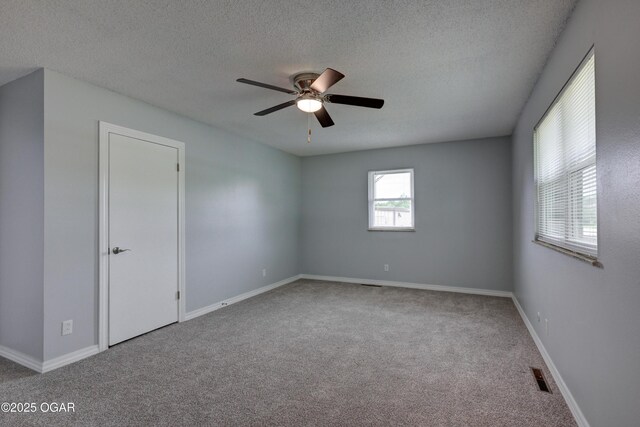 720 Sheridan Ave, Carl Junction, MO 64834 - empty room featuring carpet, ceiling fan, a textured ceiling, and baseboards