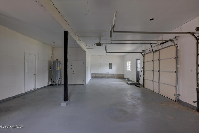 720 Sheridan Ave, Carl Junction, MO 64834 - garage with water heater, a garage door opener, and electric panel