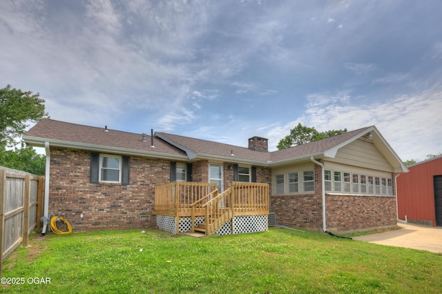 720 Sheridan Ave, Carl Junction, MO 64834 - back of house featuring brick siding, a chimney, and a wooden deck