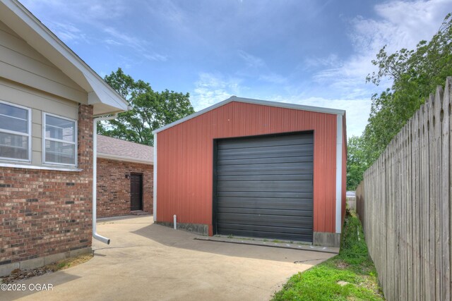 720 Sheridan Ave, Carl Junction, MO 64834 - garage featuring concrete driveway